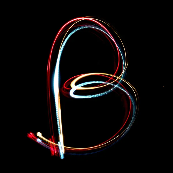 Буква b, сделанная из ярко окрашенных неоновых огней — стоковое фото