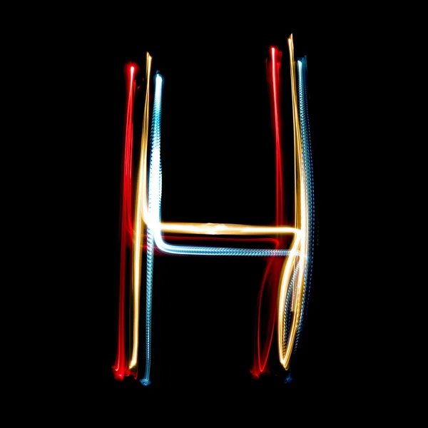 Letra H hecha de luces de neón de colores brillantes — Foto de Stock