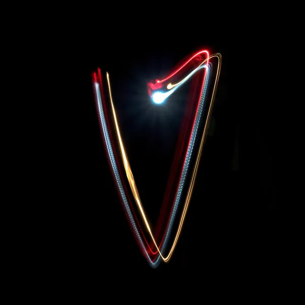 Buchstabe v aus bunten Neonlichtern — Stockfoto