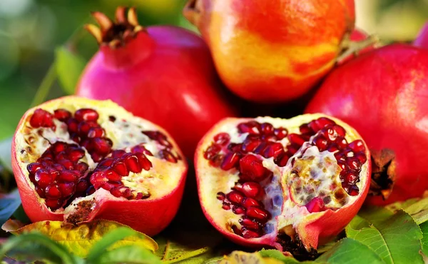 Pomegranates on table. — Stock Photo, Image