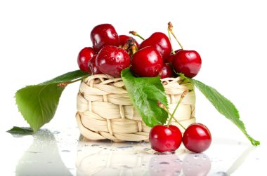 Fresh cherry berries in a basket clipart