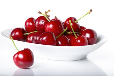 Fresh cherry berries in a plate clipart