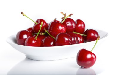 Fresh cherry berries in a plate clipart