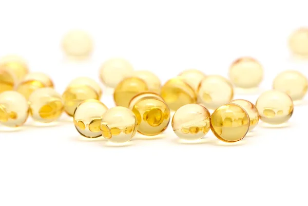Doorzichtige gele capsules — Stockfoto