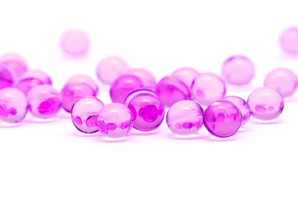 stock image Transparent purple capsules