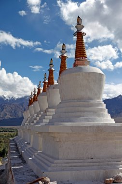 Landscape with stupas on mountain background clipart