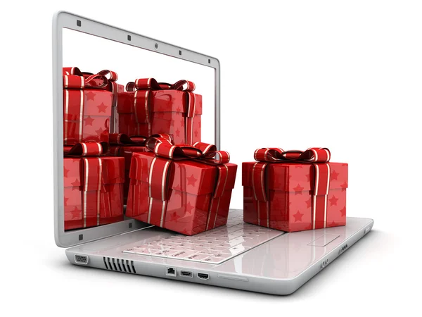 Laptop i wiele prezentów — Zdjęcie stockowe