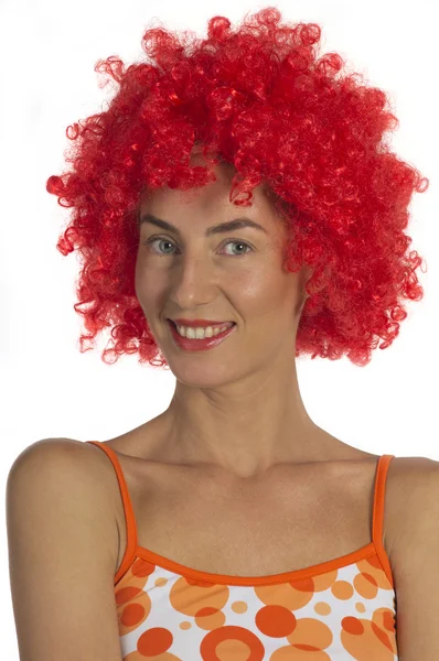 Beautiful woman in an orange wig — Stockfoto