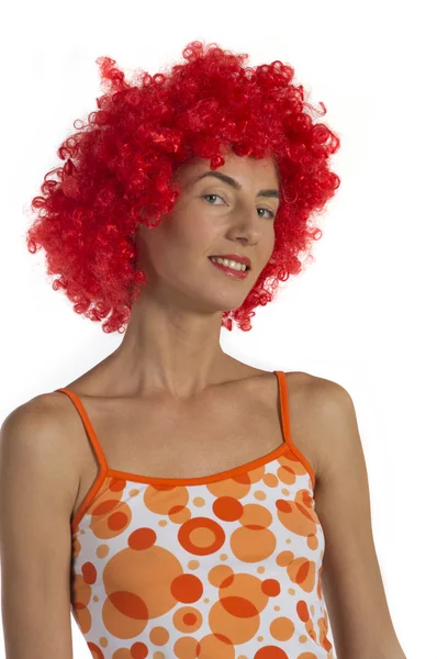 Beautiful woman in an orange wig — Stockfoto