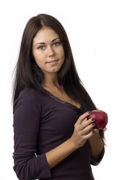 Menina bonito com uma maçã em suas mãos — Fotografia de Stock