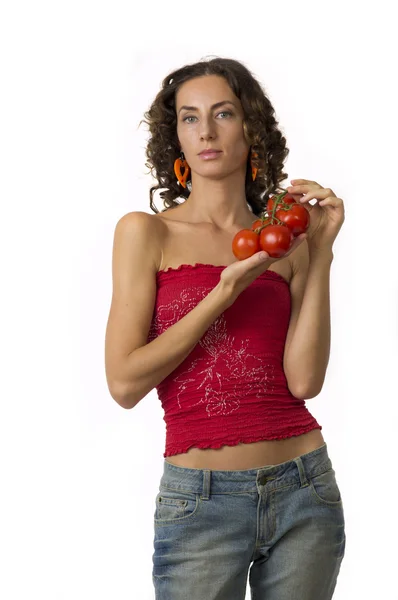 Söt flicka med tomater i dina händer — Stockfoto