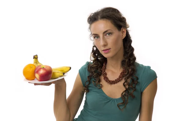 Девушка с фруктами в руках — стоковое фото