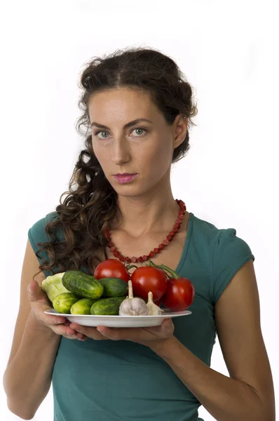 Flicka med grönsaker i dina händer — Stockfoto
