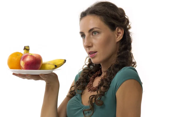 Девушка с фруктами в руках — стоковое фото