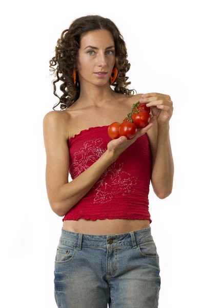 Девушка с помидорами в руках — стоковое фото