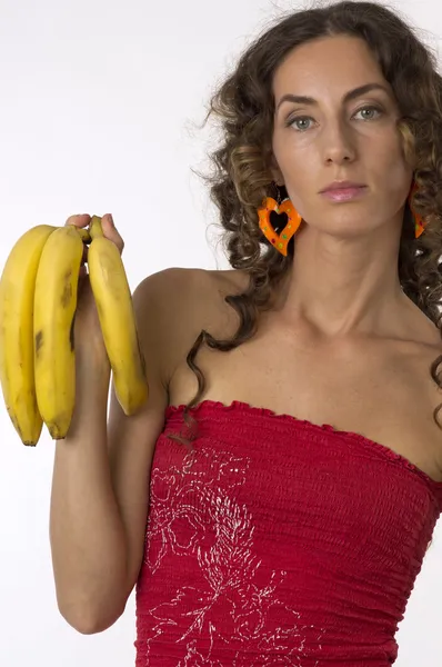 Meisje met drie bananen in hand — Stockfoto