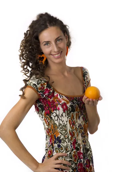 Cute girl with an orange in your hands — Stok fotoğraf