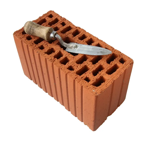Trowel with red brick. — Stock Photo, Image