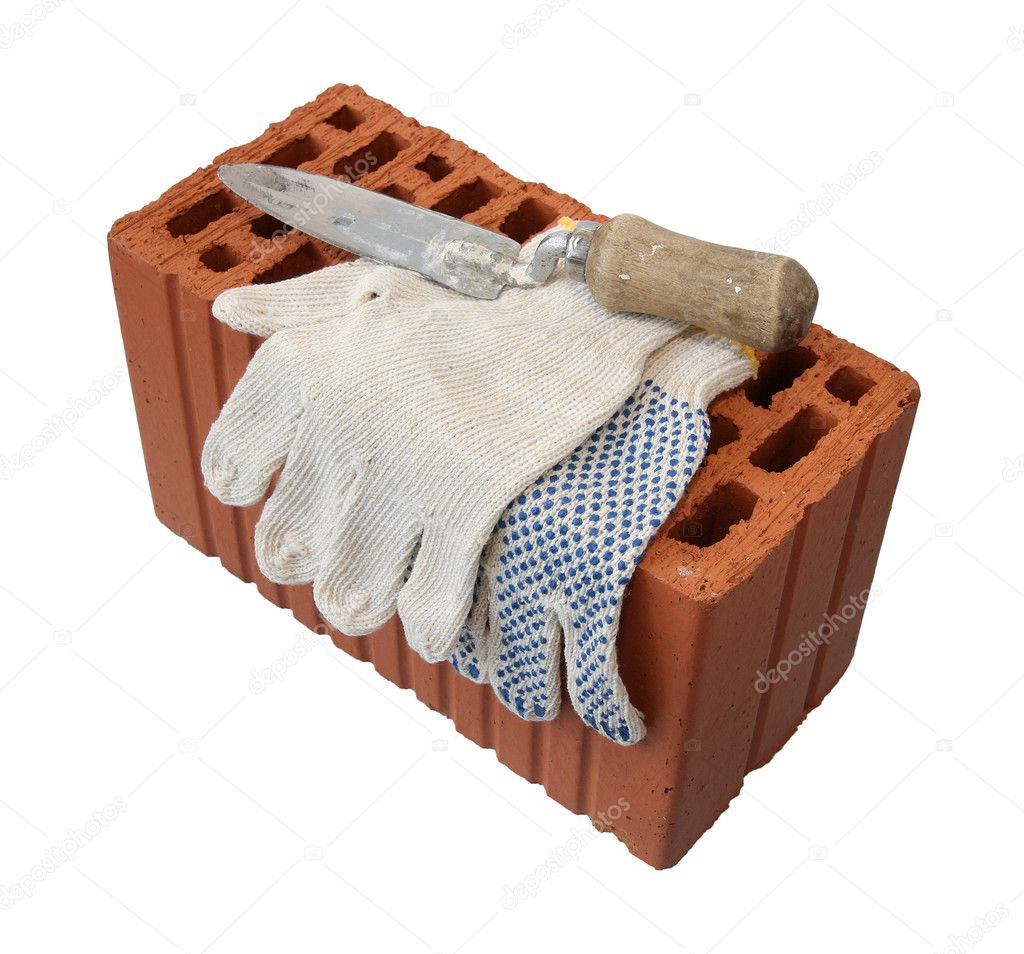 Trowel and gauntlet with red brick.