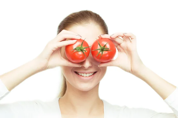 Portrait of young cheerful woman with tomatoes — Stock Photo, Image
