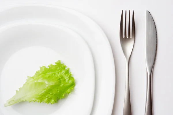 Place setting with lettuce leaf — Stock Photo, Image