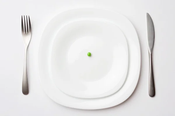 Place setting with pea — Stock Photo, Image