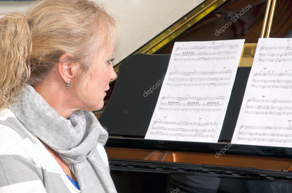 Pretty Blonde Woman At The Piano
