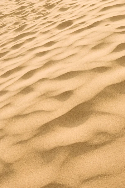 Sandstrand bakgrund Stockfoto