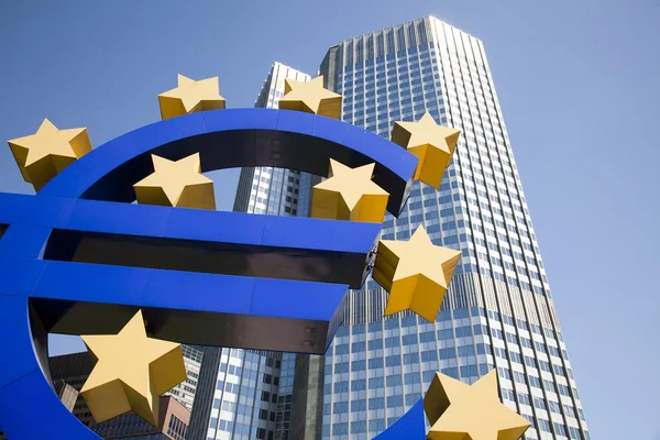 Euro sinal e cidade — Fotografia de Stock
