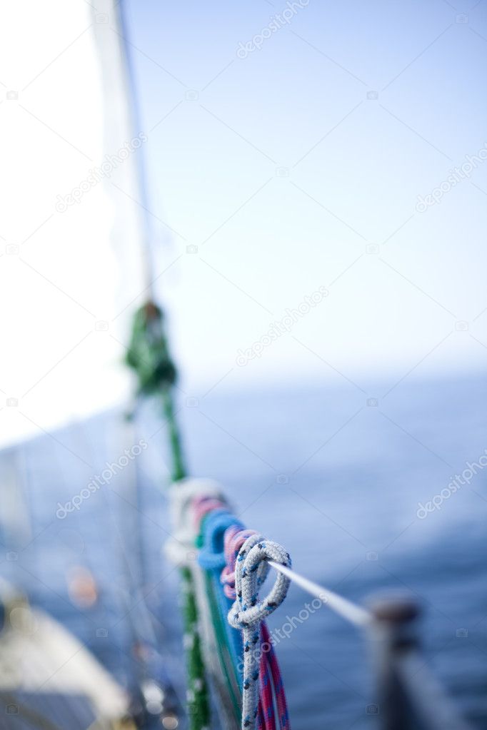 Winch with rope on sailing boat in the sea