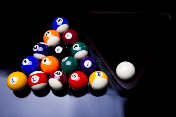 Billiard balls, cue on black table — Stock Photo, Image