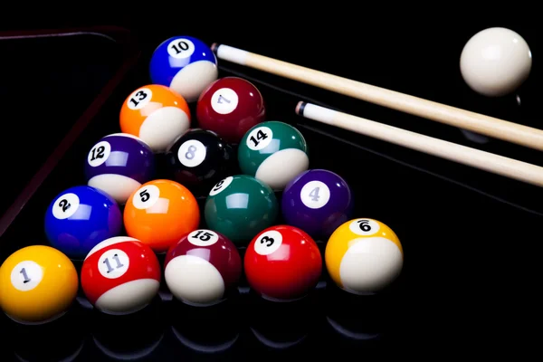 Billiard balls, cue on black table — Stock Photo, Image