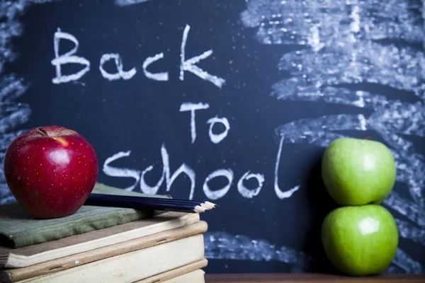 Apple on a chalkboard, healthy breakfast at school — Stock Photo, Image