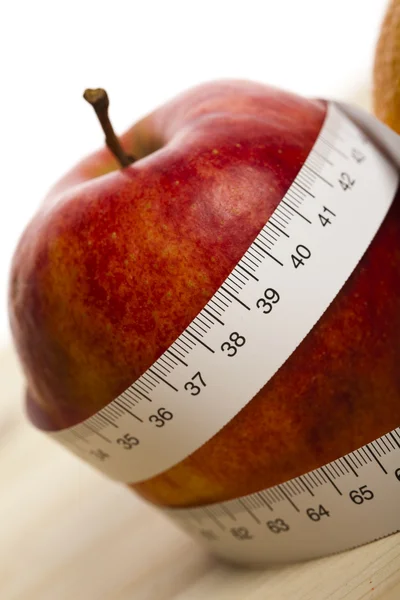 Apple and measurement tape — Stock Photo, Image