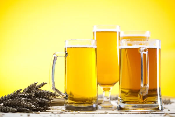 Beer glass with yellow background — Stock Photo, Image