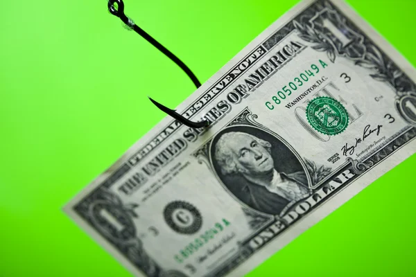 Dollarteken op stuk papier op de haak — Stockfoto