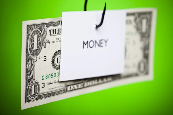 Signo de dólar en papel en gancho —  Fotos de Stock
