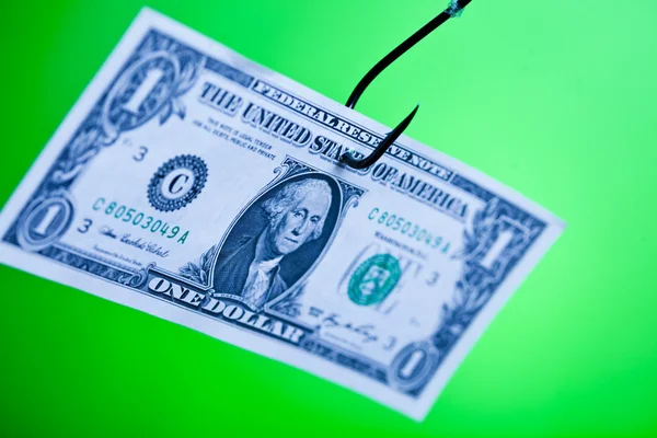 Signo de dólar en papel en gancho — Foto de Stock