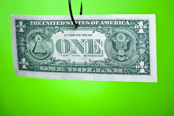 Znak dolara na kartce papieru na hak — Zdjęcie stockowe