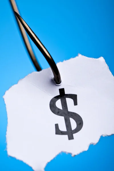 Dollar sign on piece of paper on hook — Stock Photo, Image
