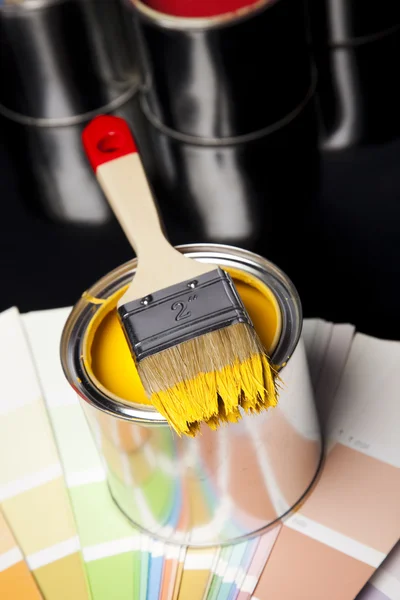 Cans of paint with paintbrush — Stock Photo, Image