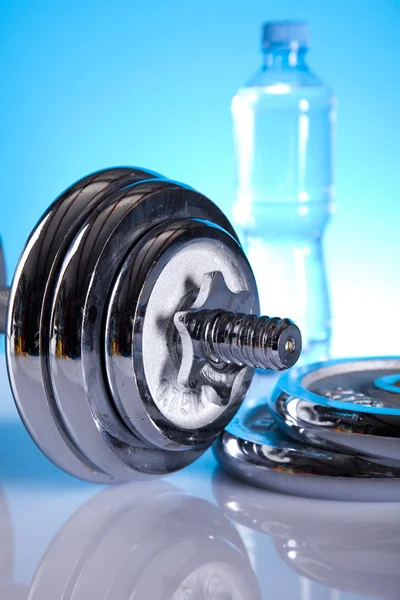 Dumbbell and bottle water — Stock Photo, Image