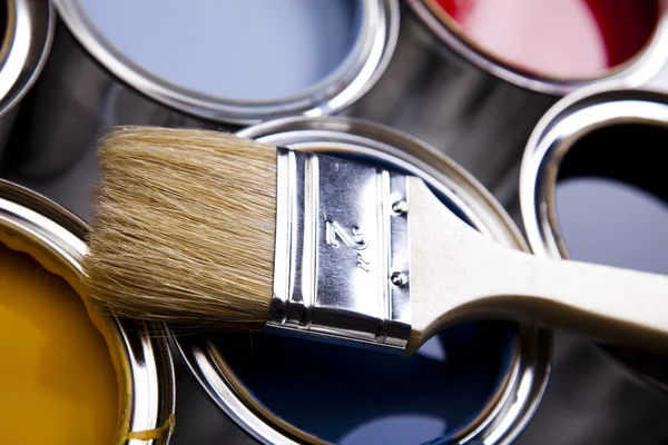 Cans of paint with paintbrush Royalty Free Stock Photos