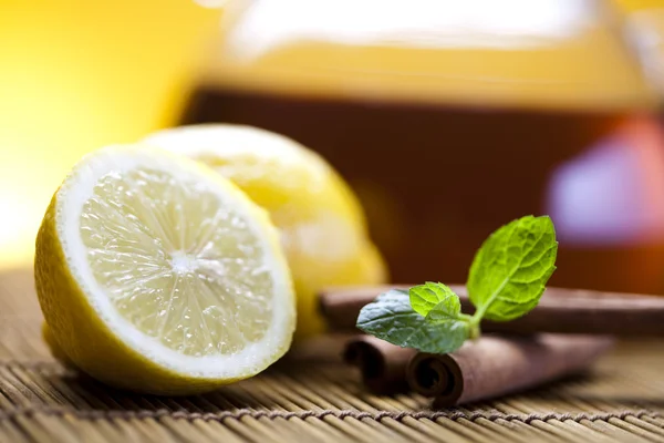 Glass teapot of tea with lemon — Stock Photo, Image