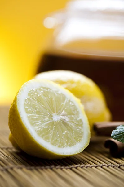 stock image Glass teapot of tea with lemon