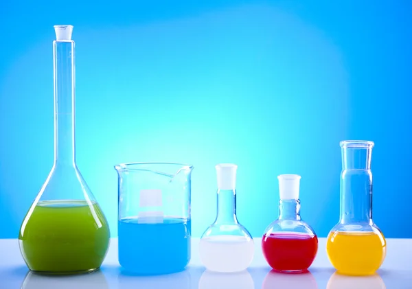 Laboratory glassware containing colorful liquid — Stock Photo, Image