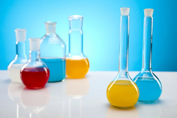 Laboratory flasks with fluids of different colors Royalty Free Stock Images