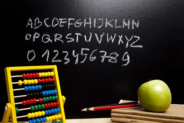 Alphabet and letters on a school blackboard — Stock Photo, Image