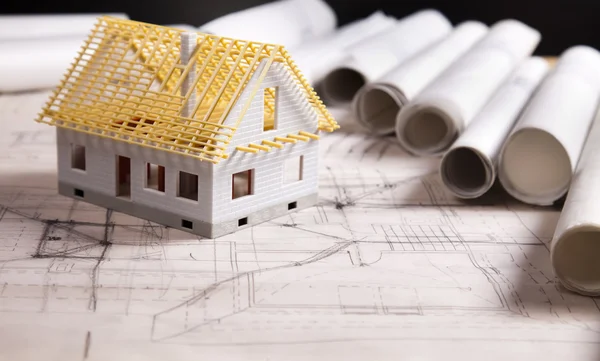 Hus på byggnadskonst planer — Stockfoto