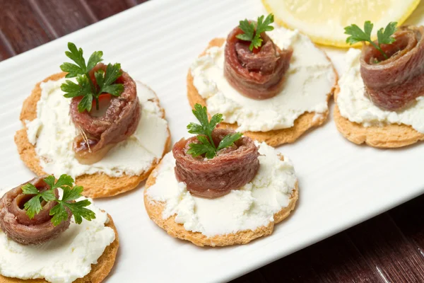 Canapes with anchovy — Stock Photo, Image